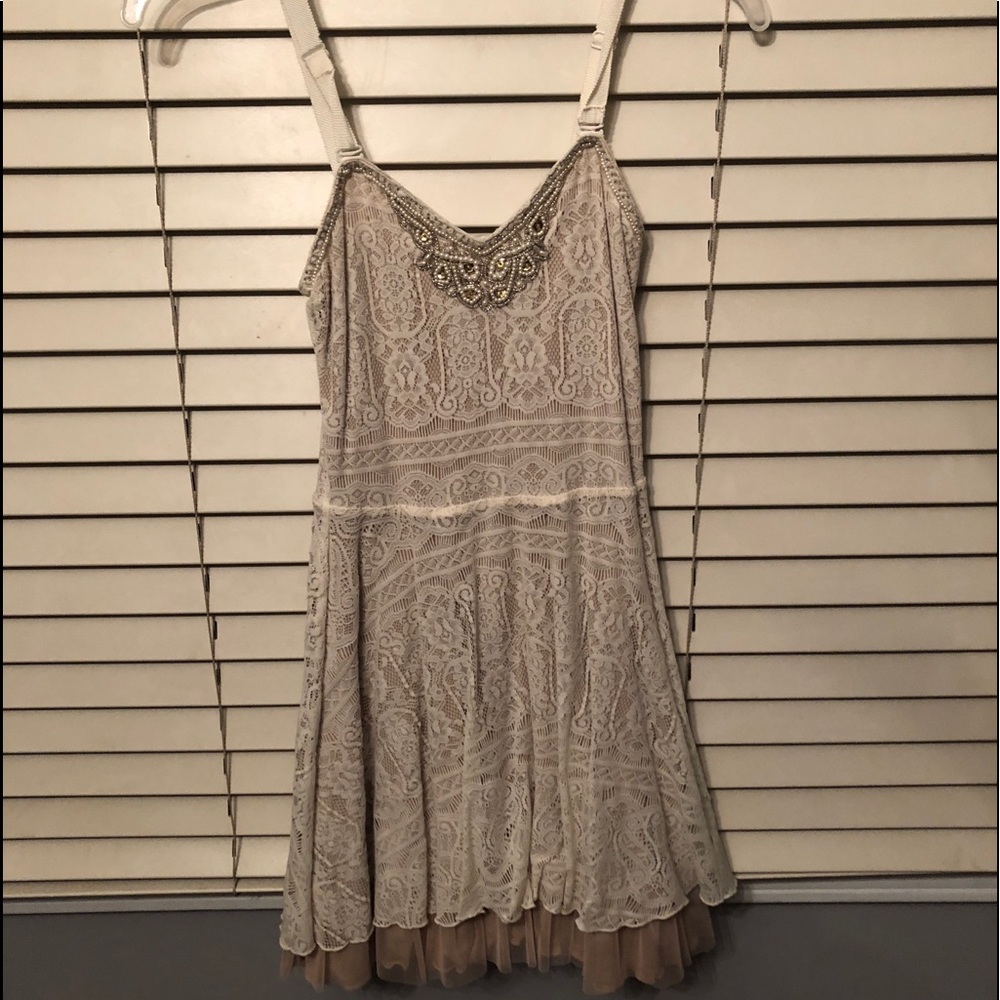 Tan Lacy dress with beading around neckline
